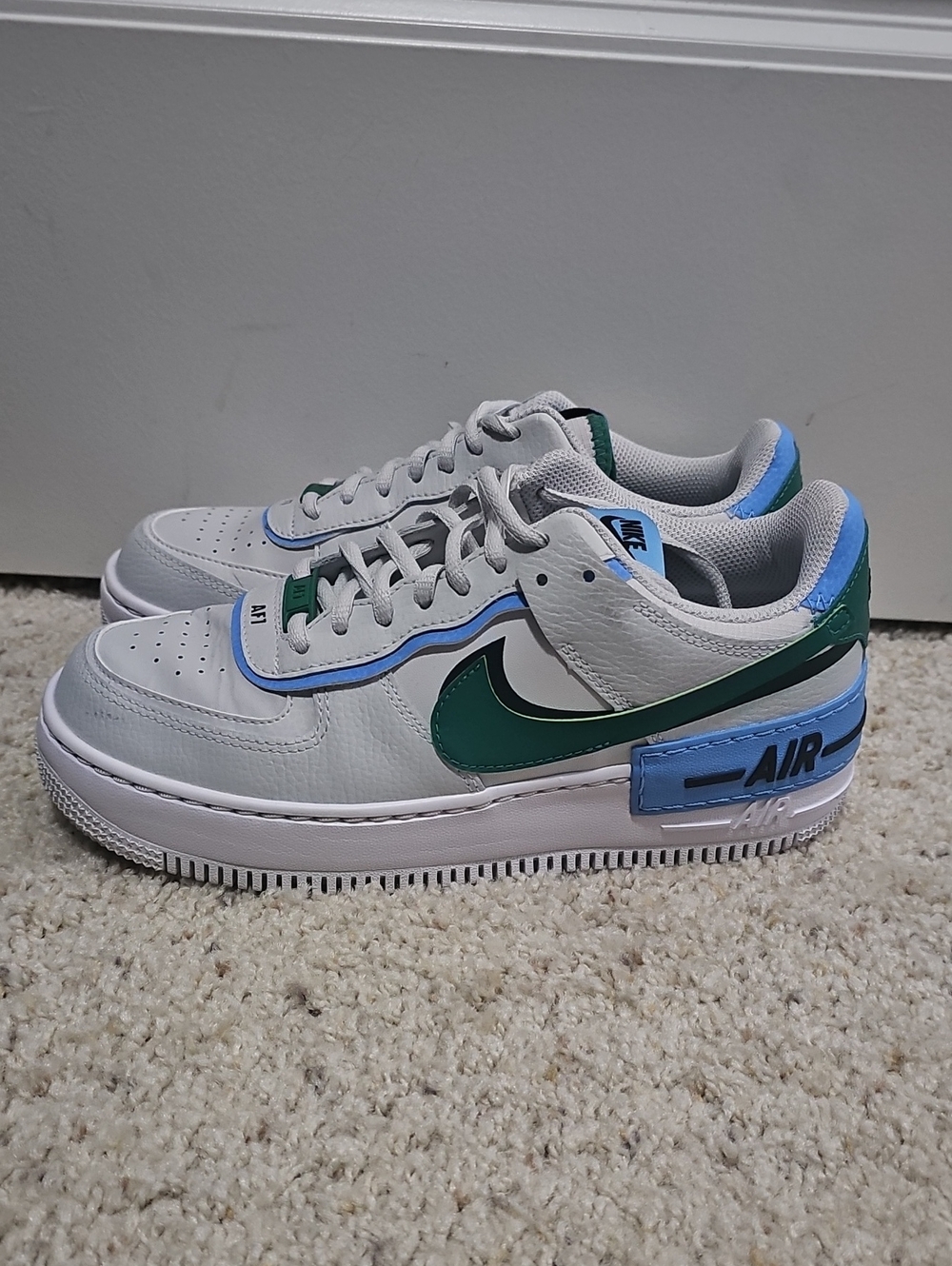 Nike Womens White Sneakers with Green Swoosh and Blue Accents